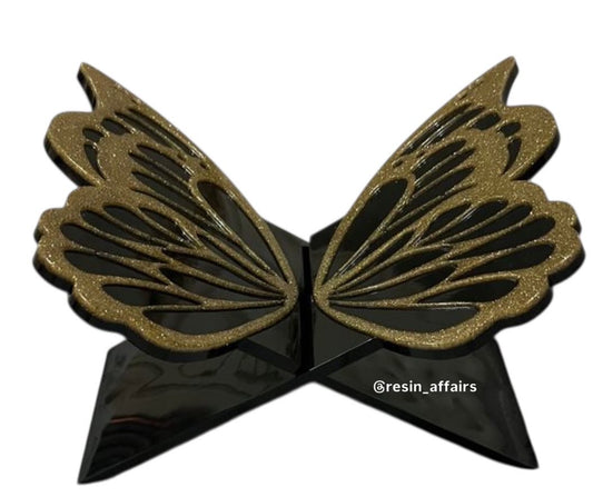 Resin butterfly bookstand with golden shimmer